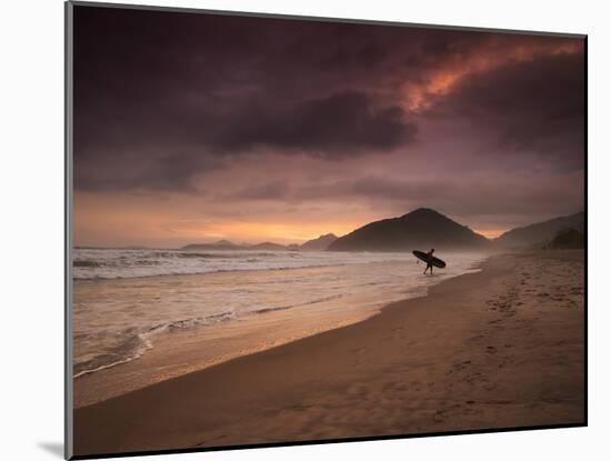 A Surfer Makes His Way Out of the Water at Praia Itamambuca in Ubatuba, Brazil-Alex Saberi-Mounted Photographic Print