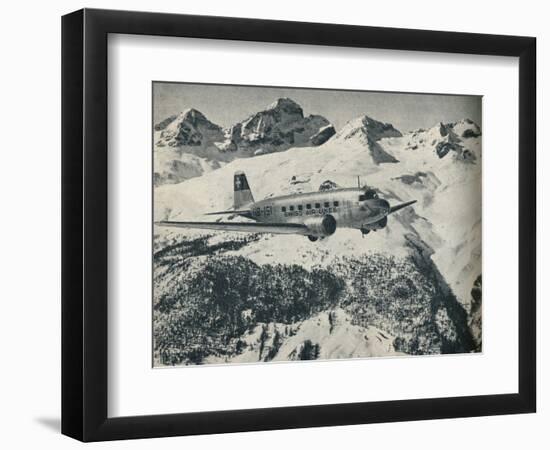 A Swissair plane flying near St Moritz Aerodrome, Switzerland, c1936 (c1937)-Unknown-Framed Photographic Print