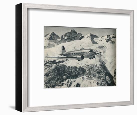 A Swissair plane flying near St Moritz Aerodrome, Switzerland, c1936 (c1937)-Unknown-Framed Photographic Print