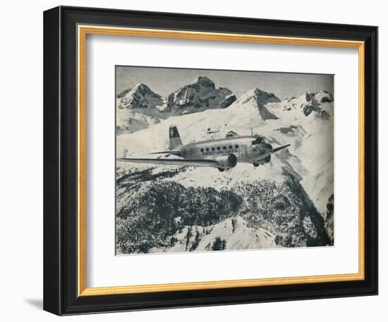 A Swissair plane flying near St Moritz Aerodrome, Switzerland, c1936 (c1937)-Unknown-Framed Photographic Print