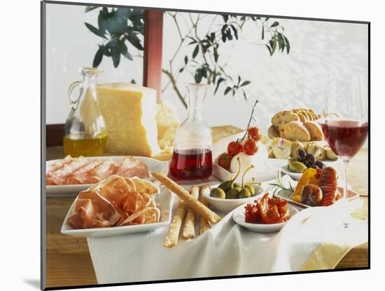 A Table Laid with Antipasti and Red Wine-Ulrike Koeb-Mounted Photographic Print