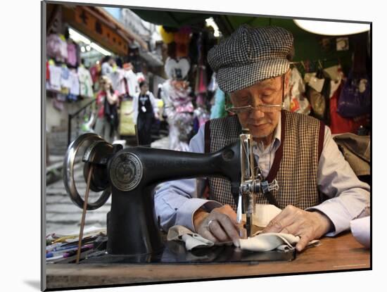 A Tailor at Work in Hong Kong, China-Andrew Mcconnell-Mounted Photographic Print