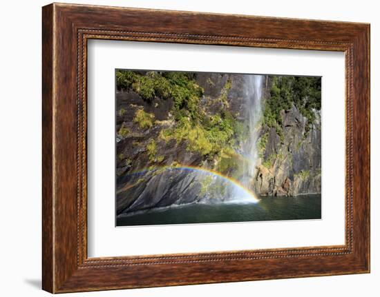 A Tall Waterfall Drops Off a Steep Cliff into Waters, Milford Sound on South Island, New Zealand-Paul Dymond-Framed Photographic Print