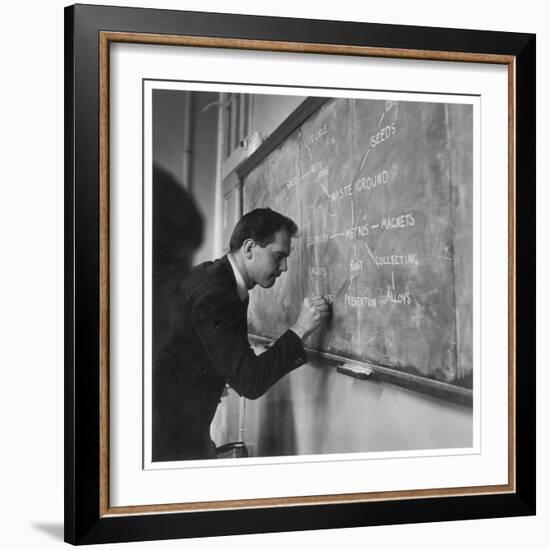 A Teacher Writing on a Blackboard at Northfield House Junior School, Leicester-Henry Grant-Framed Photographic Print