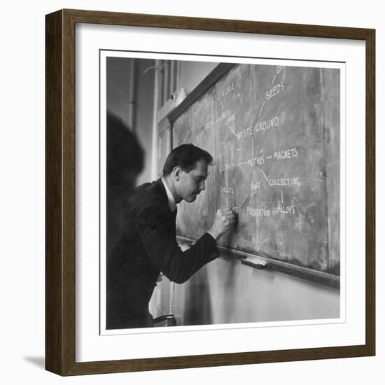 A Teacher Writing on a Blackboard at Northfield House Junior School, Leicester-Henry Grant-Framed Premium Photographic Print