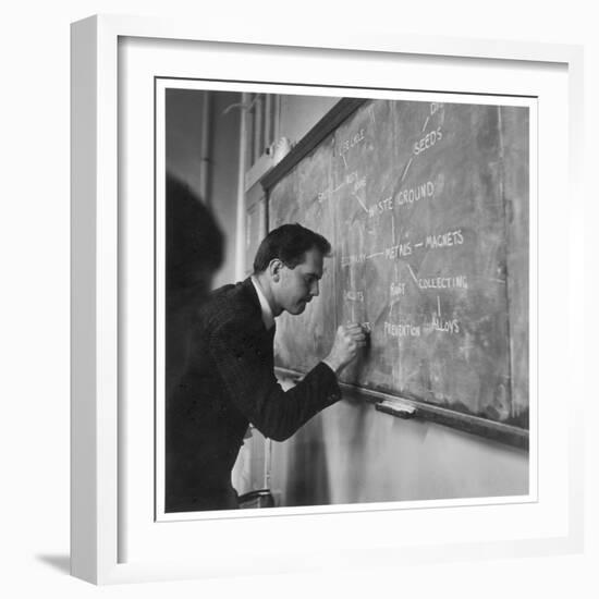 A Teacher Writing on a Blackboard at Northfield House Junior School, Leicester-Henry Grant-Framed Premium Photographic Print