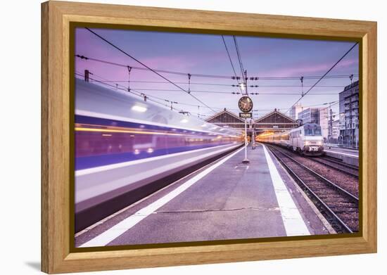 A TGV high speed train leaves the train station in Tours, Indre et Loire, Centre, France, Europe-Julian Elliott-Framed Premier Image Canvas