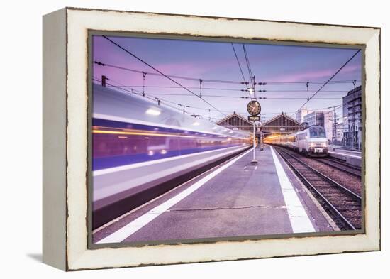 A TGV high speed train leaves the train station in Tours, Indre et Loire, Centre, France, Europe-Julian Elliott-Framed Premier Image Canvas