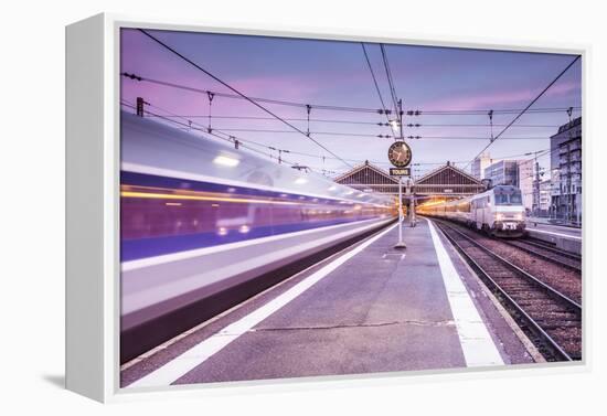 A TGV high speed train leaves the train station in Tours, Indre et Loire, Centre, France, Europe-Julian Elliott-Framed Premier Image Canvas