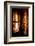 A Tibetan woman stands next to a large prayer wheel of the temple of Boudhanath Stupa, Kathmandu, N-Julian Bound-Framed Photographic Print