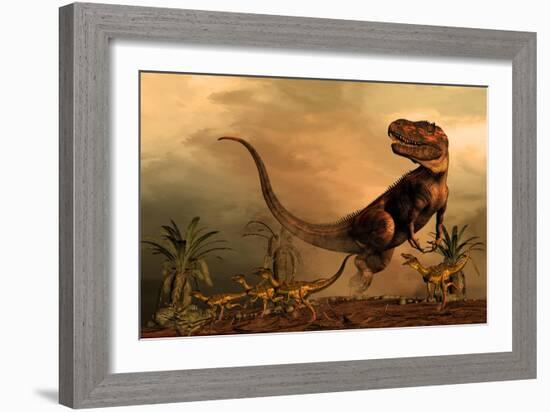 A Torvosaurus on the Prowl While a Group of Ornitholestes Flee a Hasty Retreat-null-Framed Art Print