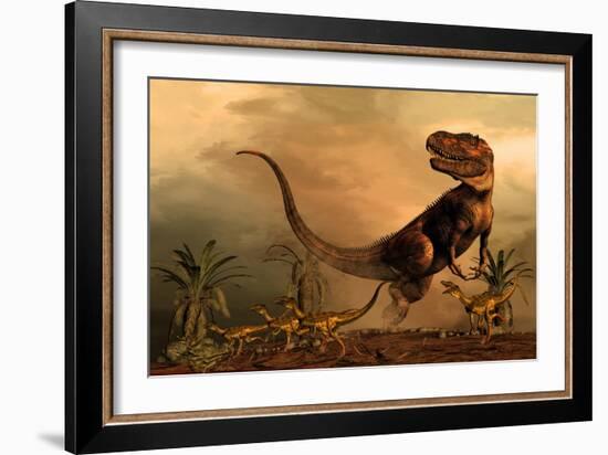 A Torvosaurus on the Prowl While a Group of Ornitholestes Flee a Hasty Retreat-null-Framed Art Print