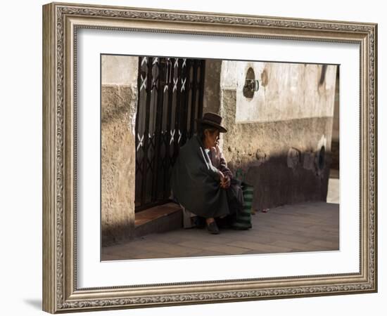 A Traditional Bolivian Woman Sits on a Doorstep in Potosi at Sunset-Alex Saberi-Framed Photographic Print