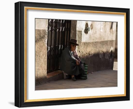 A Traditional Bolivian Woman Sits on a Doorstep in Potosi at Sunset-Alex Saberi-Framed Photographic Print