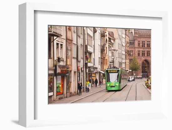 A Tram Runs Down the Streets of Basel in Switzerland, Europe-Julian Elliott-Framed Photographic Print