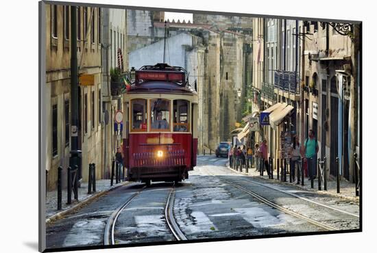 A tramway in Alfama district with the Motherchurch (Se Catedral) in the background. Lisbon, Portuga-Mauricio Abreu-Mounted Photographic Print