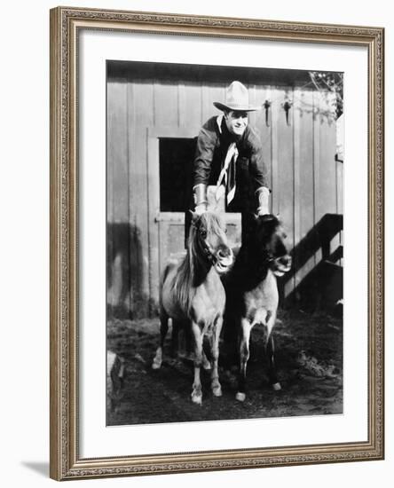 A Two Horse Power Ride, Cowboy Riding Two Ponies-null-Framed Photo