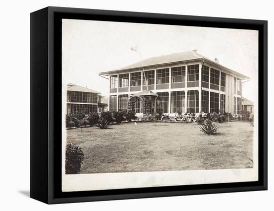 A Two-Story House Surrounded by Porches, with an American Flag Flying; in Panama During the…-Byron Company-Framed Premier Image Canvas