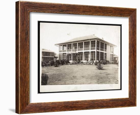 A Two-Story House Surrounded by Porches, with an American Flag Flying; in Panama During the…-Byron Company-Framed Giclee Print