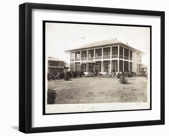 A Two-Story House Surrounded by Porches, with an American Flag Flying; in Panama During the…-Byron Company-Framed Giclee Print