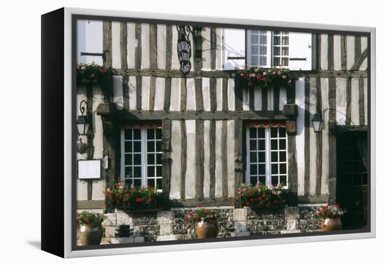 A Typical Traditional Timber Framed Building with Flowers in Window Boxes-LatitudeStock-Framed Premier Image Canvas