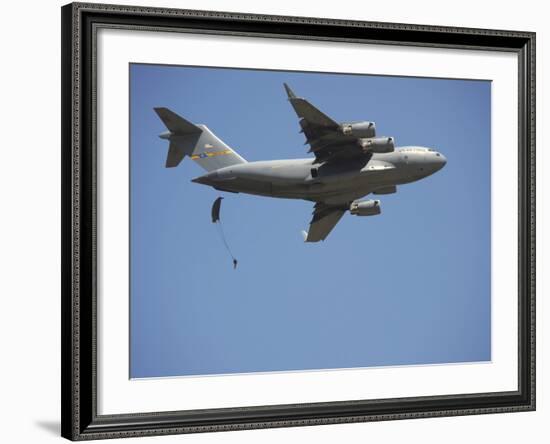A U.S. Army Paratrooper Parachutes from a C-17 Globemaster III Cargo Aircraft-Stocktrek Images-Framed Photographic Print