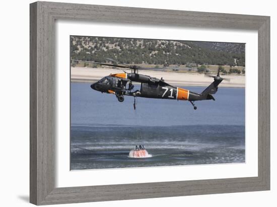 A U.S. Army Uh-60 Black Hawk Helicopter Collects Water from a Reservoir-null-Framed Photographic Print