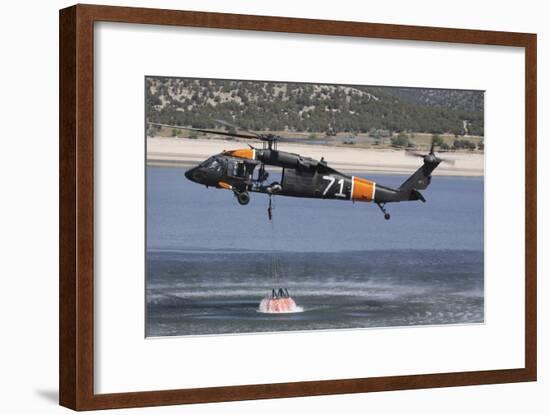 A U.S. Army Uh-60 Black Hawk Helicopter Collects Water from a Reservoir-null-Framed Photographic Print