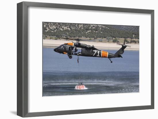 A U.S. Army Uh-60 Black Hawk Helicopter Collects Water from a Reservoir-null-Framed Photographic Print