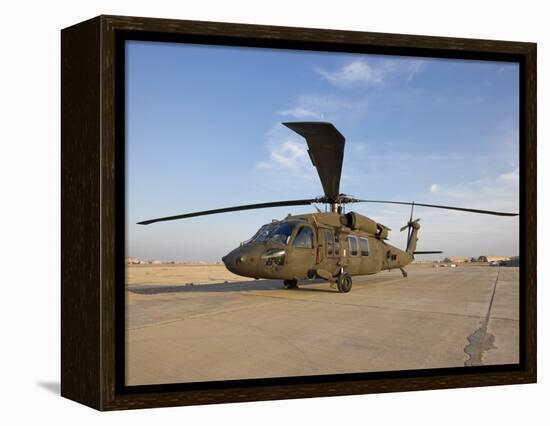 A UH-60 Black Hawk Helicopter at Camp Speicher, Iraq-null-Framed Premier Image Canvas