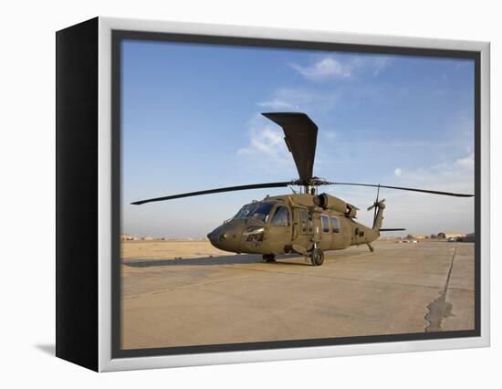 A UH-60 Black Hawk Helicopter at Camp Speicher, Iraq-null-Framed Premier Image Canvas