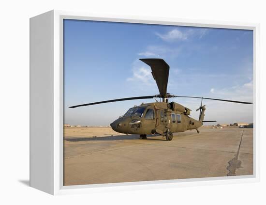 A UH-60 Black Hawk Helicopter at Camp Speicher, Iraq-null-Framed Premier Image Canvas