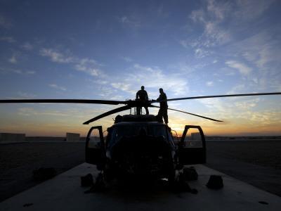 A Uh 60 Black Hawk Helicopter On The Flight Line At Sunset Photographic Print By Art Com