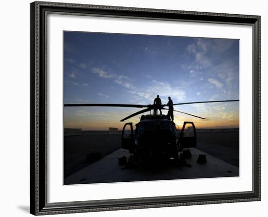 A UH-60 Black Hawk Helicopter on the Flight Line at Sunset-null-Framed Photographic Print