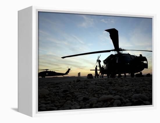 A UH-60 Black Hawk Helicopter on the Flight Line at Sunset-null-Framed Premier Image Canvas