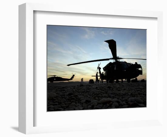 A UH-60 Black Hawk Helicopter on the Flight Line at Sunset-null-Framed Photographic Print