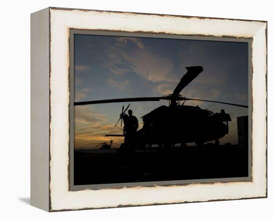 A UH-60 Black Hawk Helicopter on the Flight Line at Sunset-null-Framed Premier Image Canvas