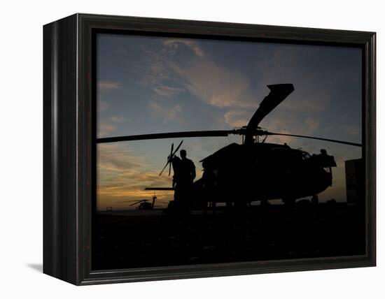 A UH-60 Black Hawk Helicopter on the Flight Line at Sunset-null-Framed Premier Image Canvas