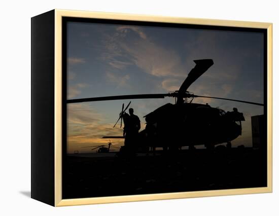 A UH-60 Black Hawk Helicopter on the Flight Line at Sunset-null-Framed Premier Image Canvas