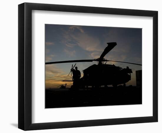 A UH-60 Black Hawk Helicopter on the Flight Line at Sunset-null-Framed Photographic Print