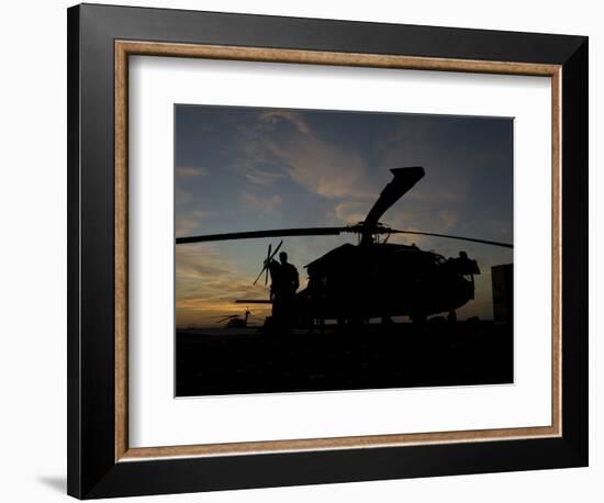 A UH-60 Black Hawk Helicopter on the Flight Line at Sunset-null-Framed Photographic Print