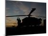 A UH-60 Black Hawk Helicopter on the Flight Line at Sunset-null-Mounted Photographic Print