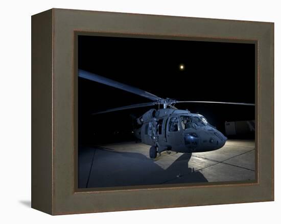 A UH-60 Black Hawk Helicopter Parked on the Flight Line under a Full Moon-null-Framed Premier Image Canvas