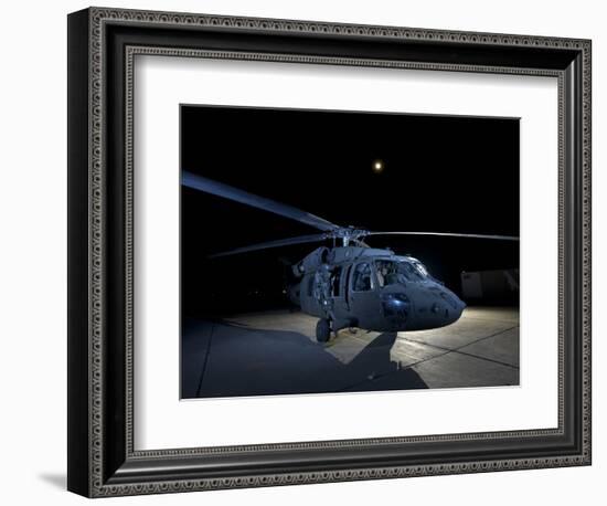 A UH-60 Black Hawk Helicopter Parked on the Flight Line under a Full Moon-null-Framed Photographic Print