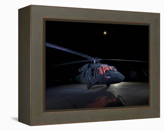 A UH-60 Black Hawk Helicopter Parked on the Flight Line under a Full Moon-null-Framed Premier Image Canvas