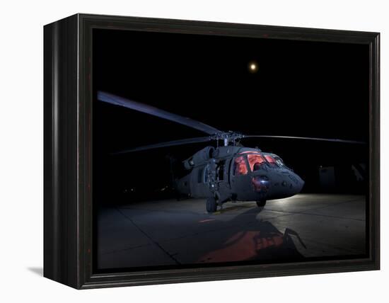 A UH-60 Black Hawk Helicopter Parked on the Flight Line under a Full Moon-null-Framed Premier Image Canvas