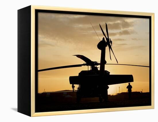 A UH-60L Black Hawk Helicopter Silhouetted by the Setting Sun-null-Framed Premier Image Canvas