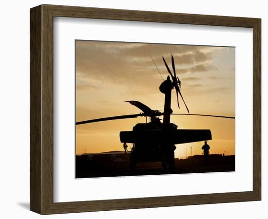 A UH-60L Black Hawk Helicopter Silhouetted by the Setting Sun-null-Framed Photographic Print