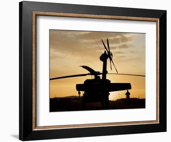 A UH-60L Black Hawk Helicopter Silhouetted by the Setting Sun-null-Framed Photographic Print