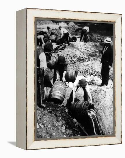 A Us Federal Agent Oversees the Destruction of Beer Kegs During the American Prohibition Era…-American Photographer-Framed Premier Image Canvas